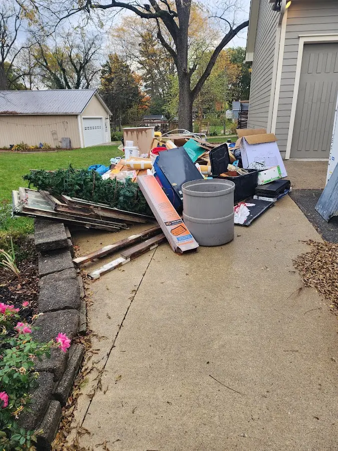 Dumpster being loaded with debris for Roofing Dumpster Rental in River Vale